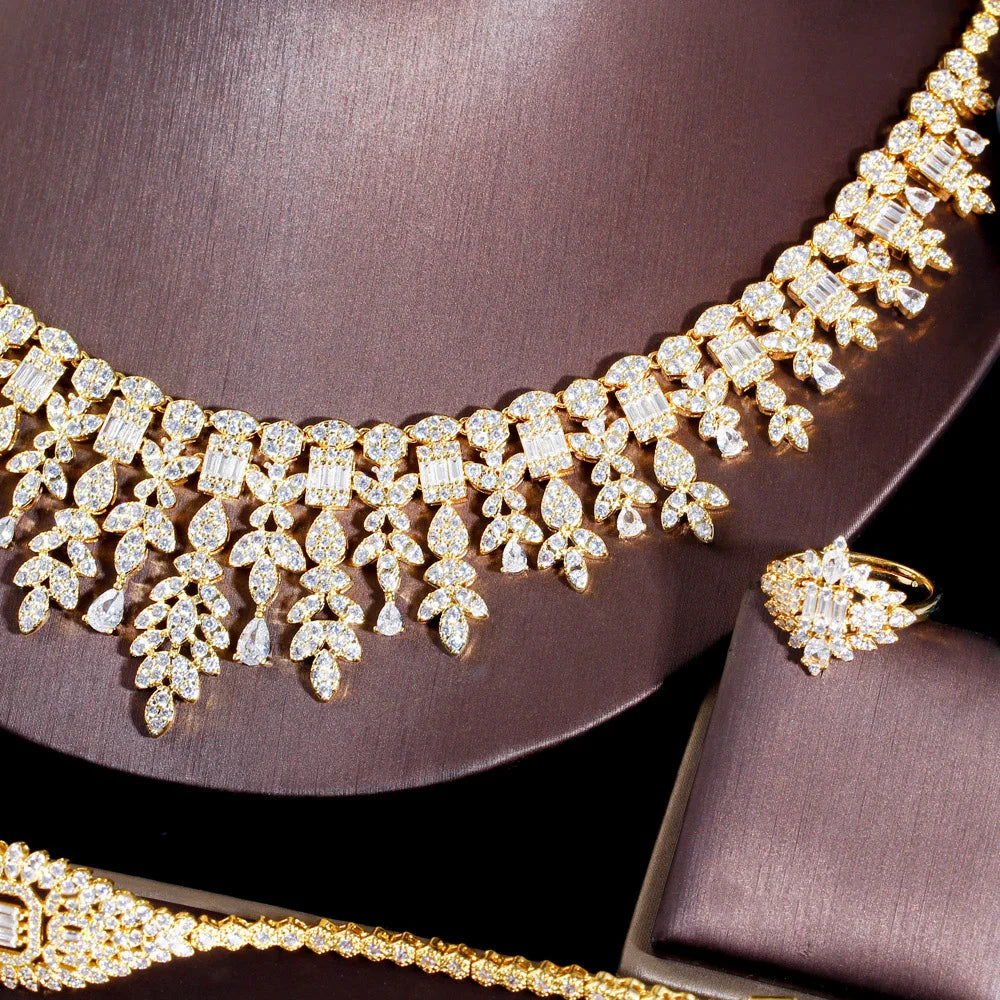 ThreeGraces 4PCS Sparkling Cubic Zirconia Gold.