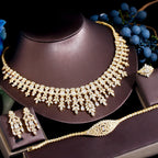 ThreeGraces 4PCS Sparkling Cubic Zirconia Gold.