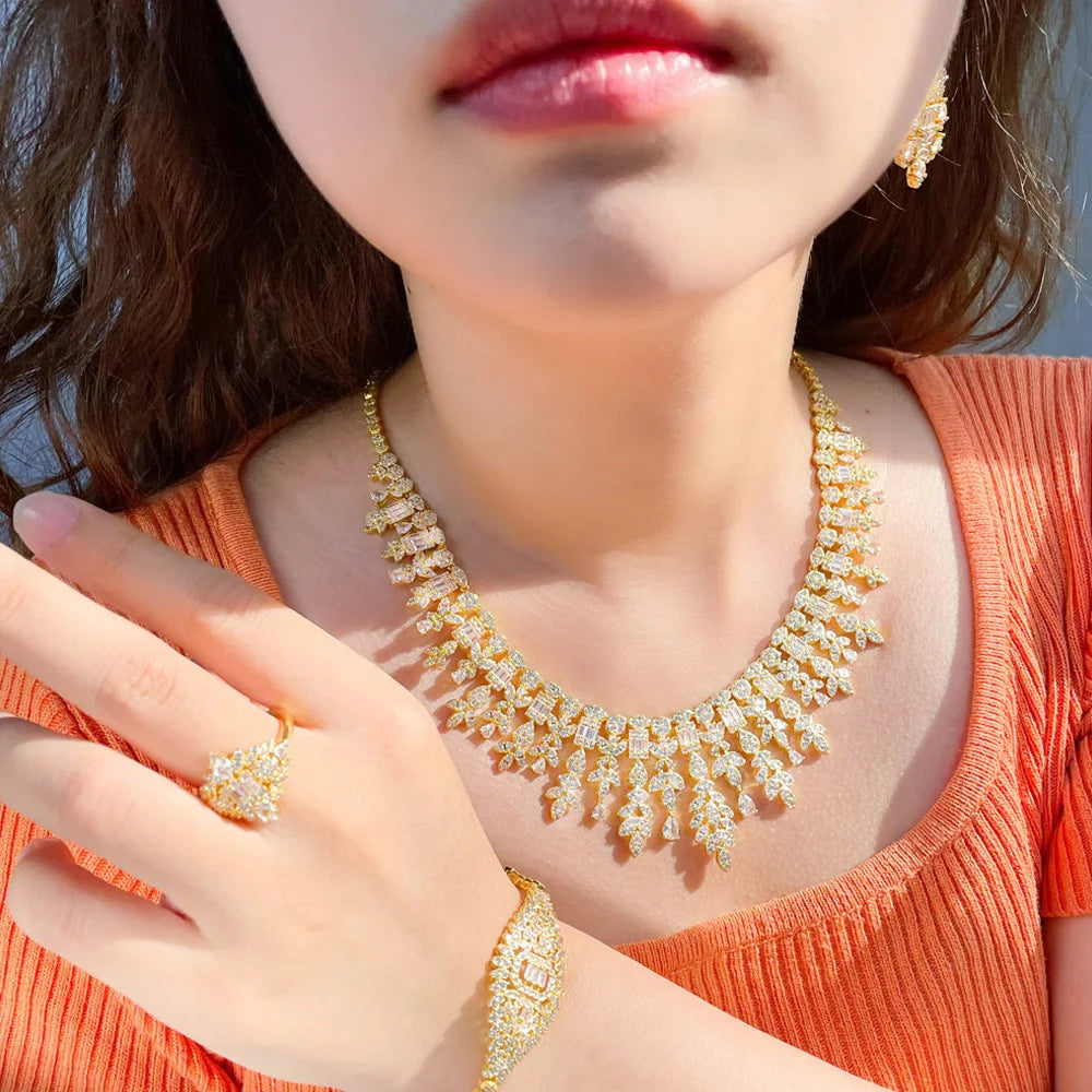 ThreeGraces 4PCS Sparkling Cubic Zirconia Gold.